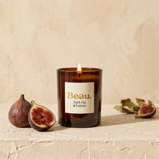 Dark Fig & Vetiver soy candle in amber glass with fresh figs